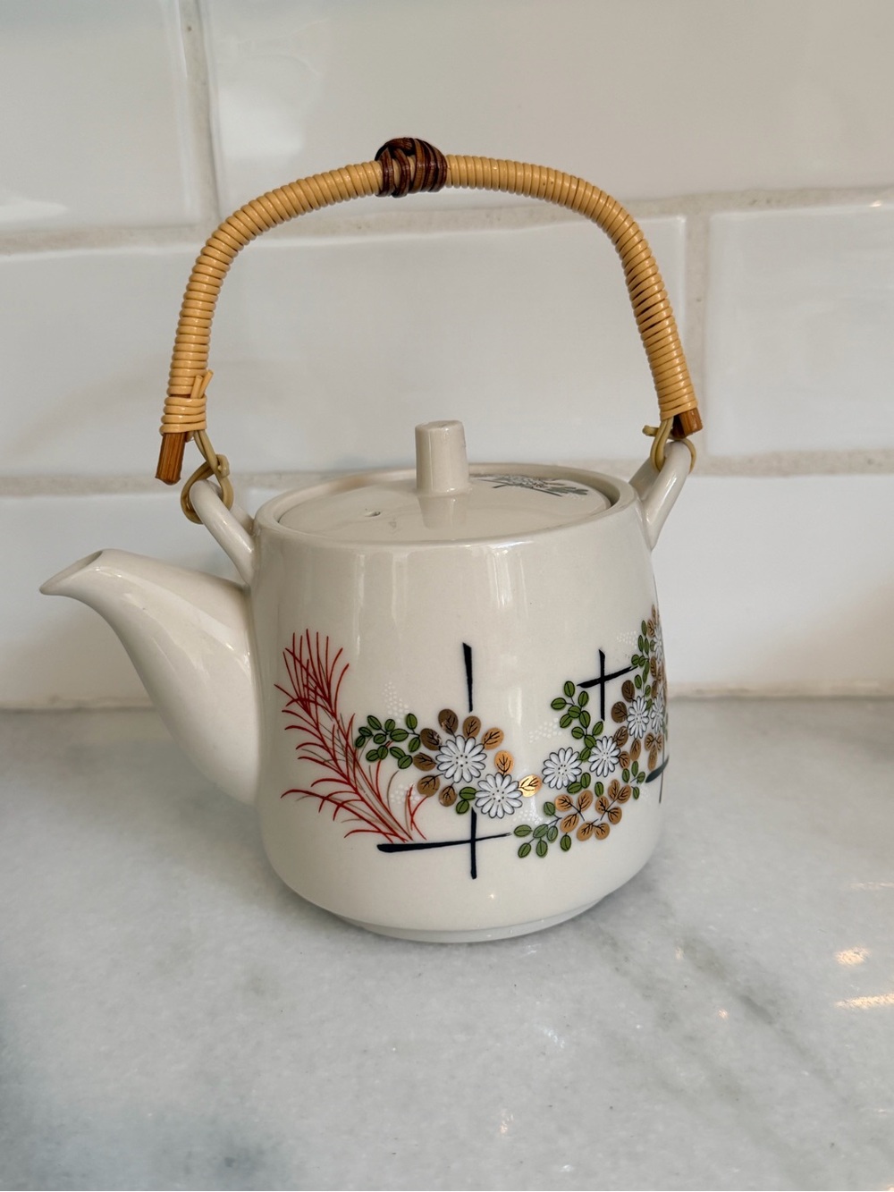 Vintage Mid-Century modern Floral Ceramic Teapot with Woven Rattan Handle